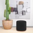 Coaster Zena Faux Sheepskin Upholstered Round Ottoman Black